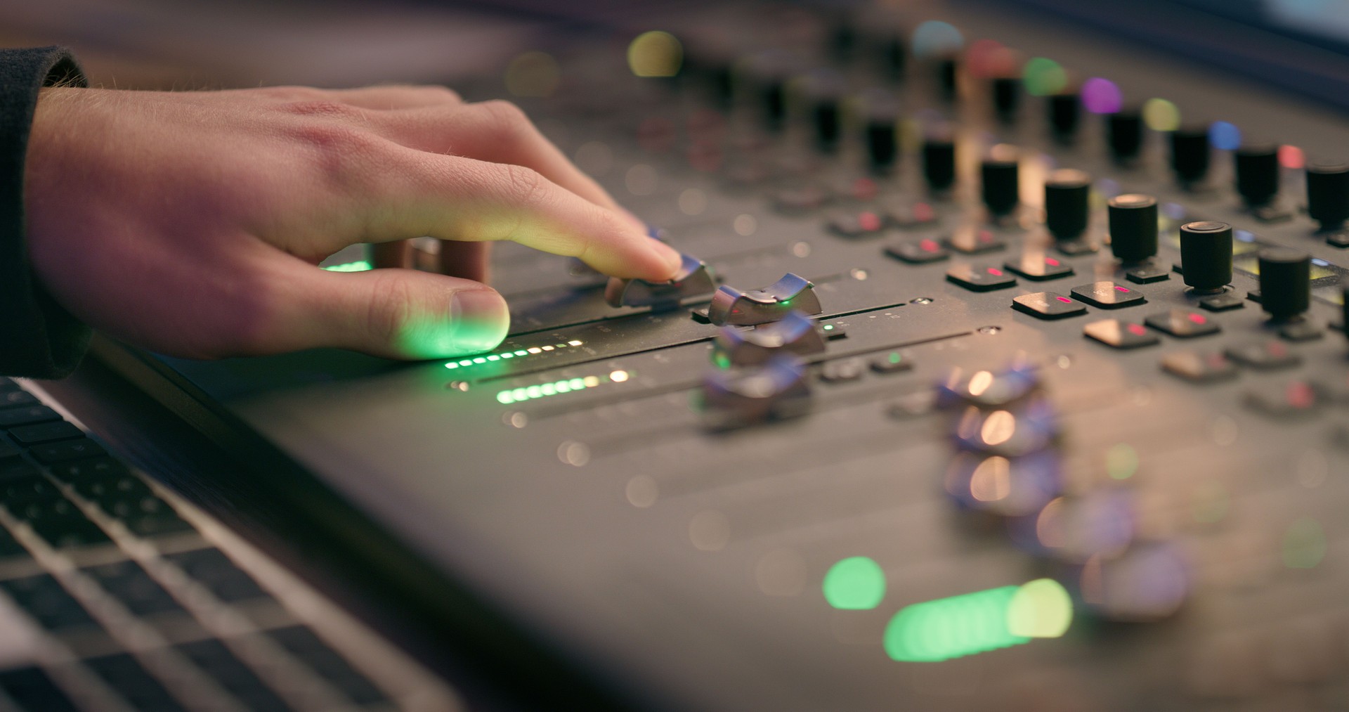 Production, dj and mixer with hands of person in recording studio for sound engineer, song edit or music. Audio technician, digital composer and equalizer equipment with closeup of producer and track